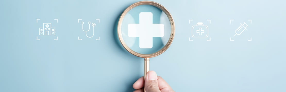 Magnifying glass viewing health insurance and medical concept.